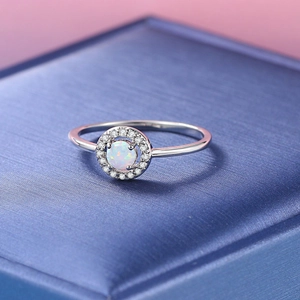 Elegant silver opal halo ring for women with round gemstone and pavé diamonds