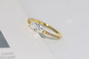 Macro shot of 14k gold marquise-cut ring with shimmering pave-set cubic zirconia