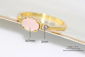 Macro shot of 14k gold plated ring with a 5x7mm pink oval zircon and side stones