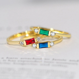 Classic gold rings set with rectangular red blue and green zircon gemstones