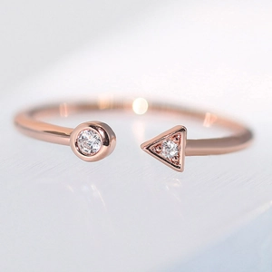 Minimalist rose gold open ring featuring geometric round and triangle zircon accents