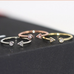 Minimalist geometric open rings in gold, silver, and rose gold with zircon stones