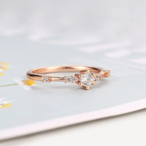 Elegant rose gold thin ring featuring seven sparkling cubic zirconia stones for women
