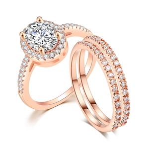 Macro view of rose gold bridal ring set with oval-cut stone and pavé diamond detail