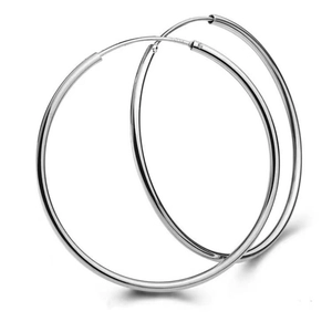 Detail showing the S925 hallmark on a pair of high-polished large silver hoop earrings