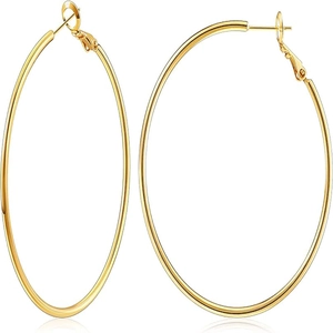 Macro detail of large gold hoop earrings with polished surface and secure latch back closure