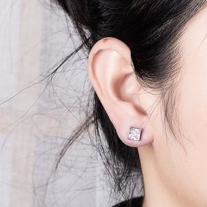 Classic square-cut zircon stud earrings in silver 4-claw setting shown on model