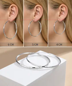 Macro detail of faceted S925 sterling silver hoop earrings in 4cm 5cm and 6cm sizes