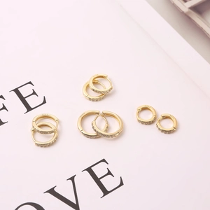 Close-up of gold-plated S925 sterling silver hoop earrings set with zircon stones