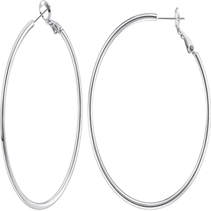 Macro detail of large polished silver hoop earrings showing secure hinge and closure