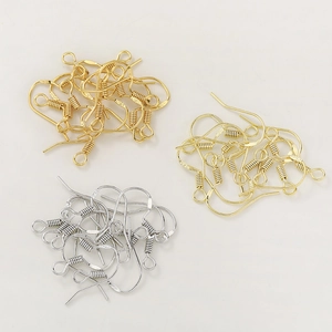 Detailed macro view of S925 sterling silver ear hooks in gold, pale gold and silver finishes