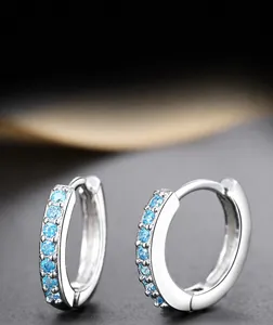 Detail view of S925 silver hoop earrings with a single row of inlaid blue zircons