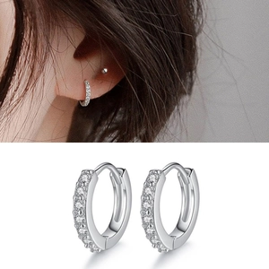 Detailed view of sterling silver hoop earrings with cubic zirconia inlay and model shot