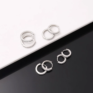 Detailed view of S925 sterling silver hoop earrings with cubic zirconia and silver hallmark