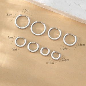 Set of minimalist silver hoops in four sizes: 1.5cm, 1.3cm, 1.0cm, and 0.9cm diameter