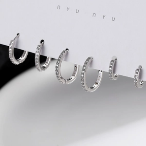 Set of 6 silver zircon hoop earrings in various sizes displayed on a minimalist card