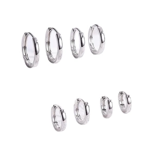 Set of four pairs of polished silver hoop earrings in varying sizes on white background