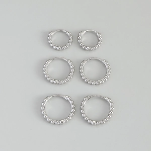 Three pairs of S925 sterling silver beaded hoop earrings in varied sizes on grey background
