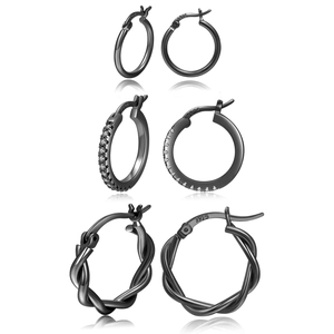 Detail of three black S925 sterling silver hoop earrings with smooth, paved and twisted textures