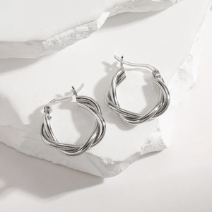 Twisted hoop earrings in S925 sterling silver with a sleek metallic finish and minimalist design