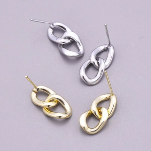 Polished silver and gold double linked hoop earrings in a minimalist twisted metal design
