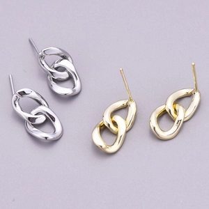 Detail of silver and gold double-hoop chain stud earrings with polished finish