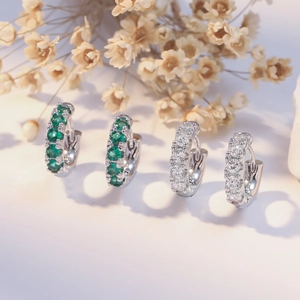 Thick silver hoop earrings with green and clear cubic zirconia stones for women