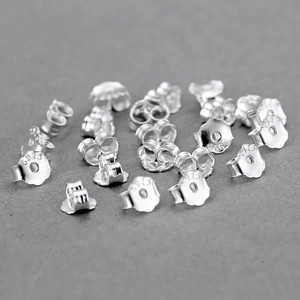 Macro shot of 925 sterling silver butterfly earring backs with S925 hallmark