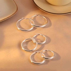Three pairs of classic chunky S925 silver hoop earrings in large, medium, and small sizes
