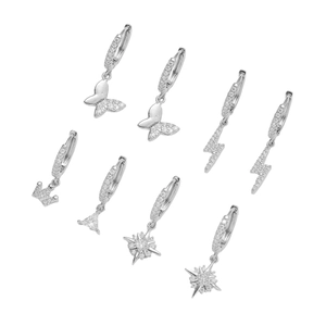 Set of four silver hoop earrings with zircon pendants in butterfly and star shapes
