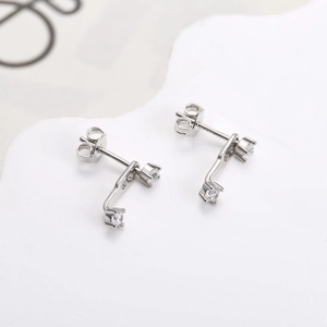 S925 sterling silver stud earrings with round cubic zirconia in a modern layered design