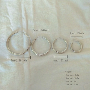 Detailed comparison of silver hoop earrings in four sizes: 3cm, 4cm, 5cm, and 6cm diameter