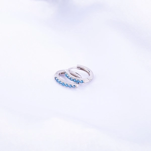 Elegant S925 sterling silver hoop earrings featuring blue cubic zirconia inlay stones