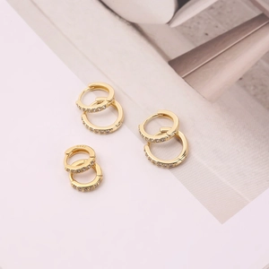Close-up of gold-plated S925 sterling silver hoop earrings with micro-paved zircons