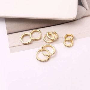 Detailed view of S925 gold plated hoop earrings with micro-pave cubic zirconia crystals