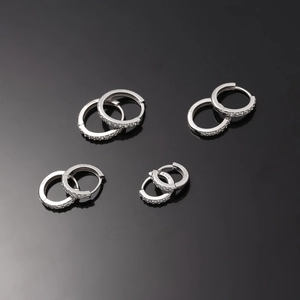 Detailed view of S925 sterling silver hoop earrings with micro-pave cubic zirconia inlay