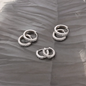 Classic S925 sterling silver hoop earrings with cubic zirconia pave on gray leaf backdrop