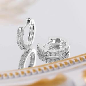 Classic 925 sterling silver huggie earrings with shimmering pavé cubic zirconia