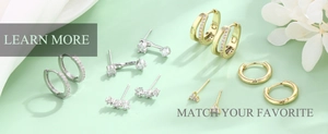 Flat lay of gold and silver S925 stud earrings with zircon floral and heart shapes