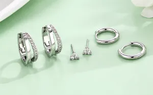 Detailed view of S925 silver earring set with sparkling zircon floral and hoop designs