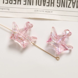 Detail of pink iridescent heart charms for DIY hair accessories and phone straps