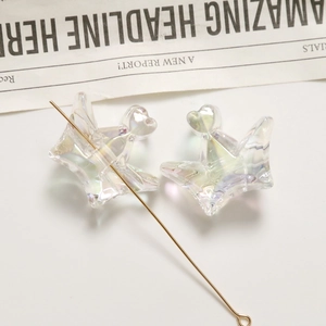 Detailed macro view of heart-shaped crown acrylic beads with colorful Aurora finish