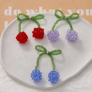 Handmade beaded crystal cherry bow charms in red, blue, and purple for DIY jewelry making