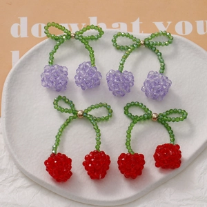 Handmade beaded cherry charms with crystal bows in red and purple for jewelry making