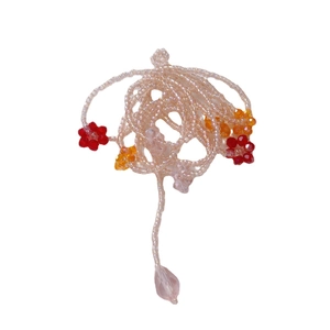 Handmade beaded long floral necklace with colorful crystal flowers and a pink teardrop charm
