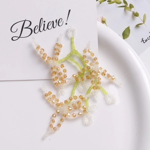Handmade beaded crystal flower stems and lily of the valley petals for DIY hair accessories