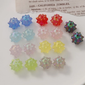 Macro shot of 18 colorful spiky acrylic beads for DIY jewelry making and crafts