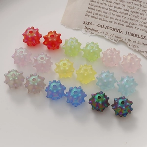 Macro shot of colorful sea urchin shaped acrylic beads for DIY jewelry making and crafts