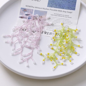 Handmade beaded flower tassel charms in pink and green for DIY jewelry making