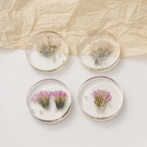 Set of four clear resin earrings with dried flowers and small pearls for DIY jewelry
